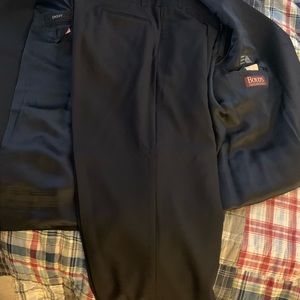 Men’s navy four button DKNY suit